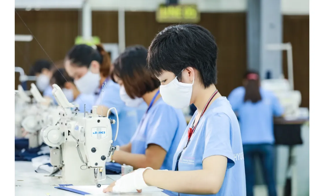 vietnamese garment companies a worker sewing masks